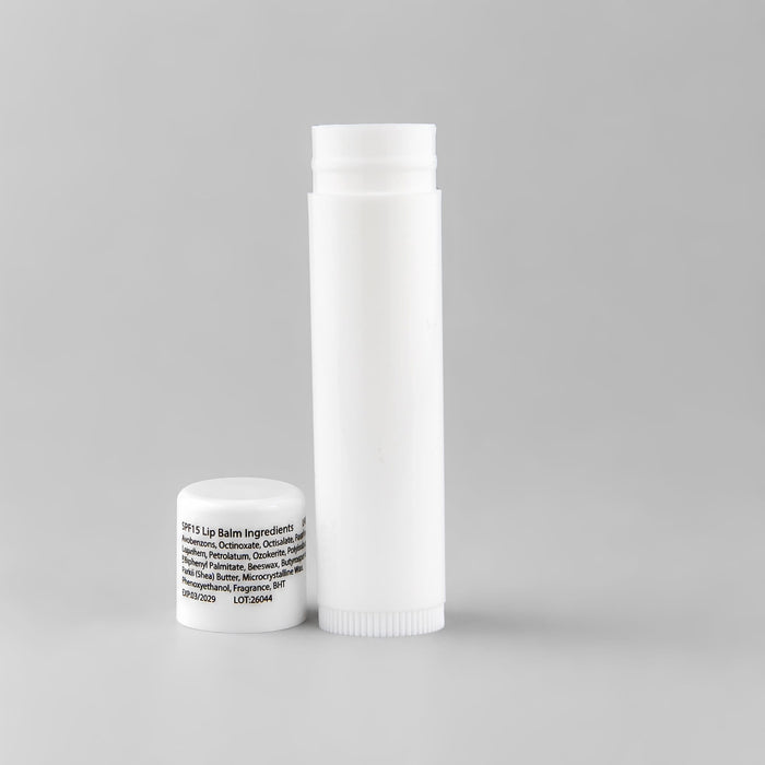 Flavoured Lip Balm SPF - A white lip balm container and a small white cap, featuring an unobtrusive logo.