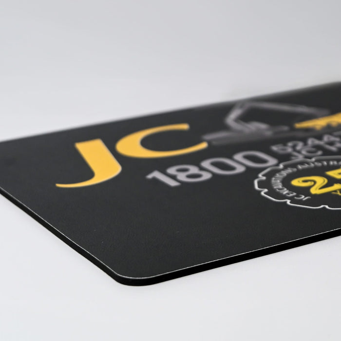 Fabric Mouse Mat (225mm x 185mm) - A fabric mouse mat in black with yellow accents and a logo. The dimensions are 225mm x 185mm.