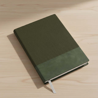Murica Notebook B5 - A black B5 notebook with a ribbed cover, resting on a wooden desk, featuring a ribbon bookmark.