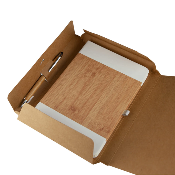 Cardboard Notebook Gift Box - A cardboard gift box containing a bamboo notebook and a pen, all in natural tones.