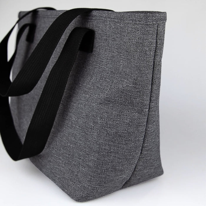 Bavarian Lunch Bag - A grey lunch bag with black straps, featuring a simple design and an external logo.