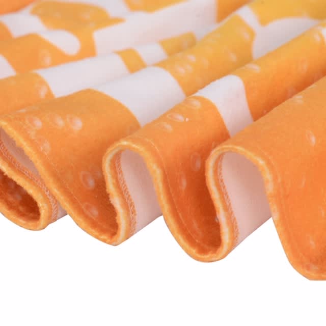 Bath Sheet - An orange and white patterned face washer with a soft, textured edge, featuring a wavy fold. It has a branding logo.
