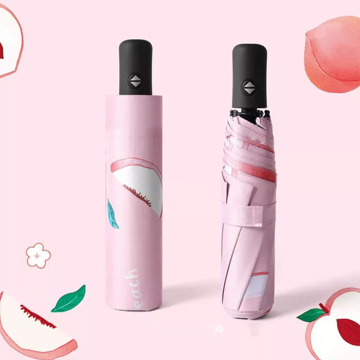 Full Colour Poppins Umbrella - A pink umbrella with a peach design, featuring a compact case and a black handle. It has a logo.