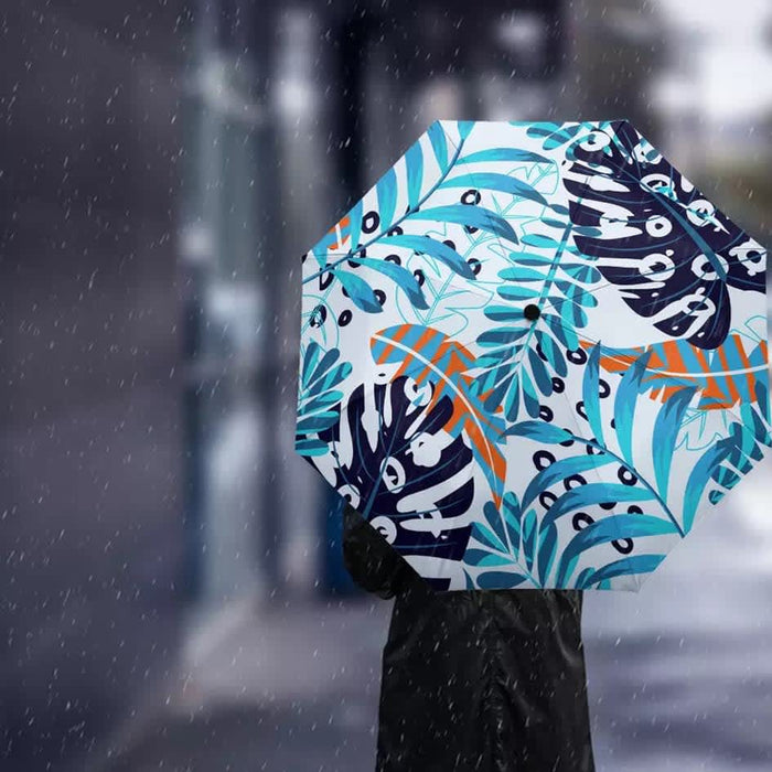 Full Colour Poppins Umbrella - A full-colour umbrella featuring a tropical design with blue, green, and orange patterns against a white background.