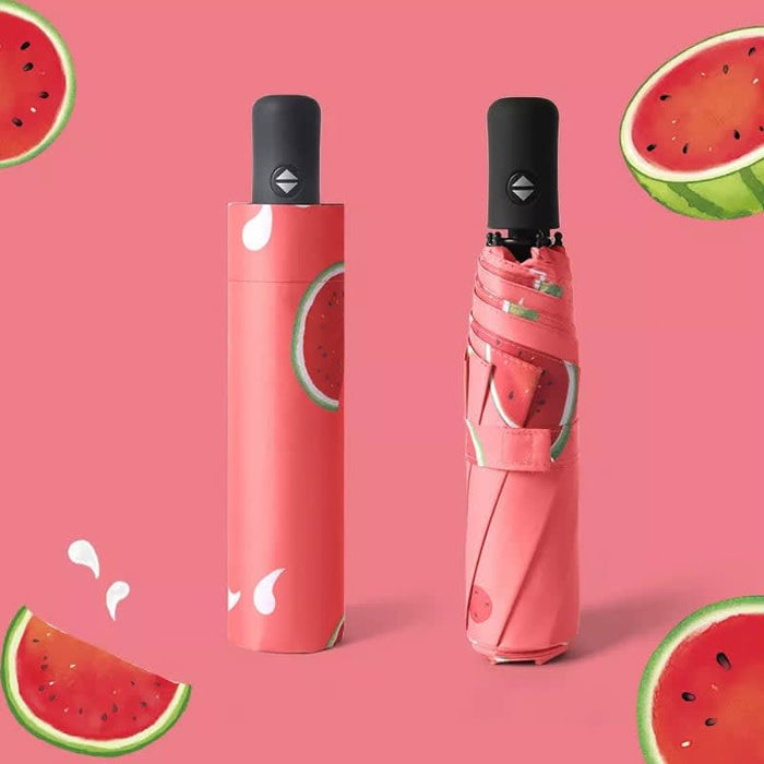 Full Colour Poppins Umbrella - A full colour umbrella featuring a watermelon print, with a matching protective cover in a pink hue.