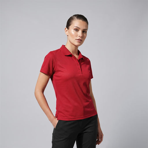 Women's Smash Polo - A red women's polo shirt featuring a collar and a branded logo.