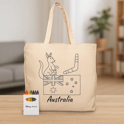 Squiggle Calico bag + Crayon set - A beige tote bag featuring an illustration of a kangaroo and Australian symbols, accompanied by a crayon set.