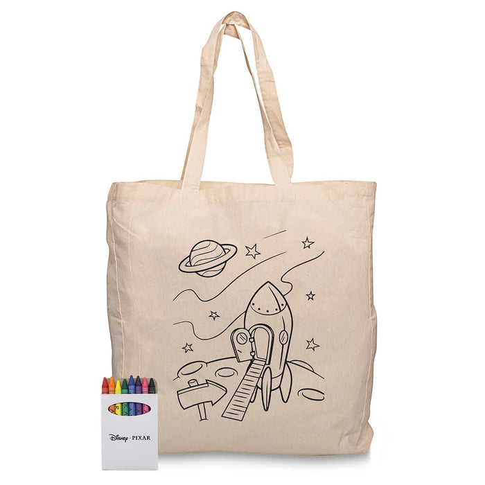Squiggle Calico bag + Crayon set - A cream-coloured calico bag featuring a rocket and space scene, accompanied by a set of colourful crayons.