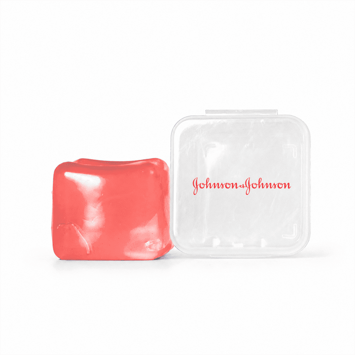 Jelly Cube Sensory Toy - A red jelly cube sensory toy beside a transparent plastic case with a logo.