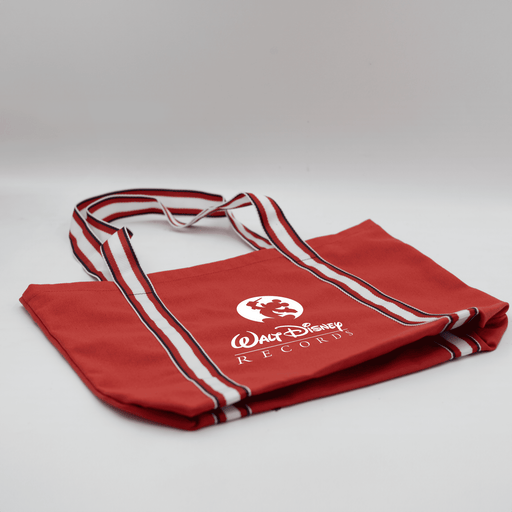 Century Canvas Tote Bag - A red canvas tote bag with white striped handles and a logo on the front.