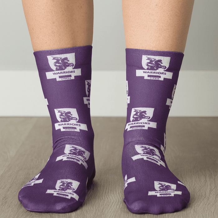 Magic Dress Socks - Purple socks featuring a pattern with lions and logos, showcasing a vibrant design and comfortable fit.