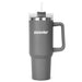 The Hippo 1.2L Mug - A drink bottle in matte grey with a clear lid, straw, and a sturdy handle. It features a logo on the front.