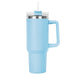 The Hippo 1.2L Mug - A drink bottle in light blue with a stainless steel rim and a clear lid featuring a straw.