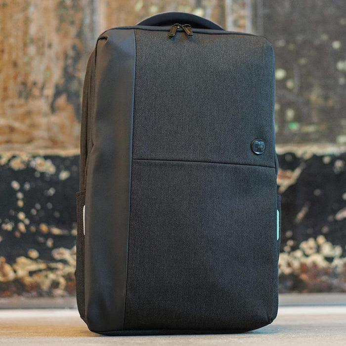 Swissdigital Arosa Backpack - A sleek black backpack with a textured finish and a branding logo on the front.