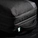 Swissdigital Arosa Backpack - A black backpack with a textured exterior and a mint green zipper pull, featuring a side handle.