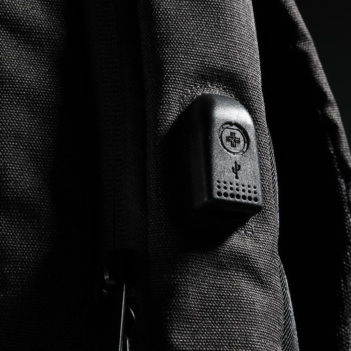 Swissdigital Arosa Backpack - A black backpack with a textured surface and a small logo integrated into the design.