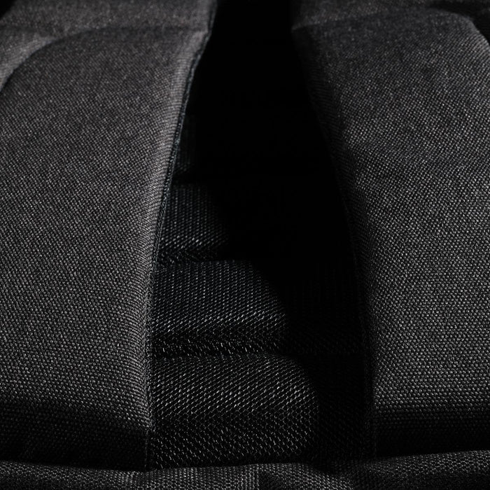 Swissdigital Arosa Backpack - A close-up of the Swissdigital Arosa Backpack's padded back panel in black fabric, featuring mesh detailing.