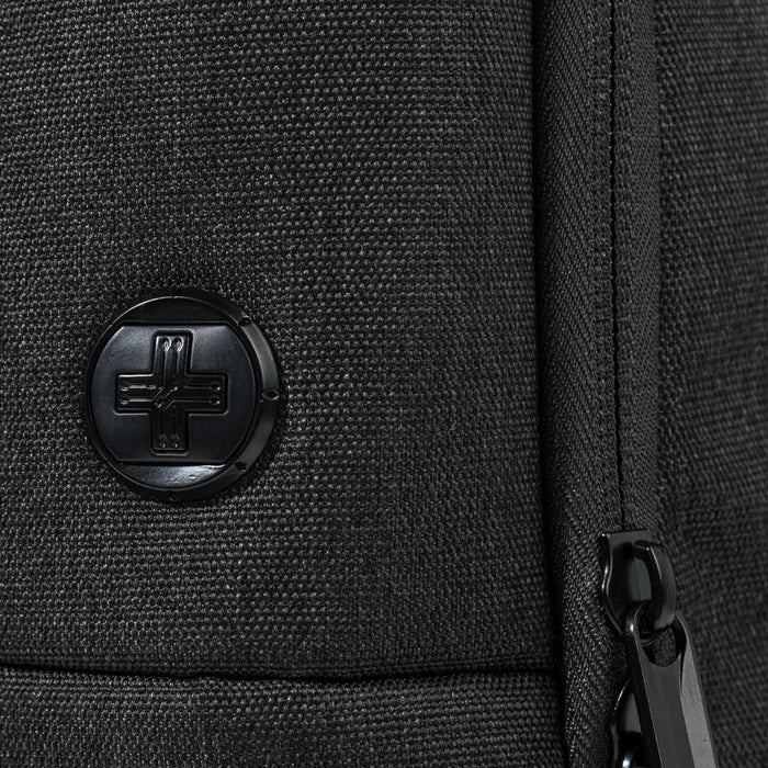 Swissdigital Arosa Backpack - A black backpack featuring a textured surface and a round logo. The zipper detail is also visible.