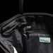 Swissdigital Arosa Tote Bag - An interior view of a black tote bag featuring RFID protection, a zip pocket, and branding.
