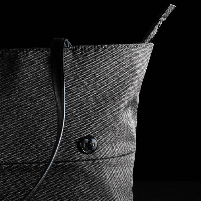 Swissdigital Arosa Tote Bag - A black tote bag with a structured design and a sleek shoulder strap, featuring a circular logo.