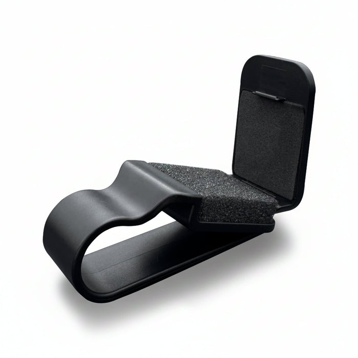 Car Visor Sunglass Holder - A black car visor sunglass holder with foam padding and a clip design for secure attachment.