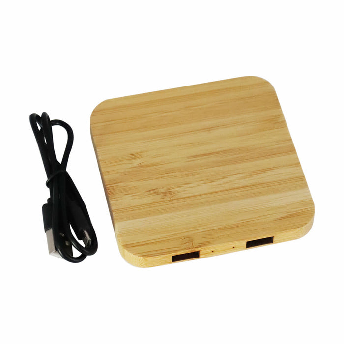 Trafalgar Bamboo charging dock - A bamboo wireless charging dock with two USB ports and a black charging cable.