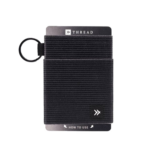 Thread Elastic Wallet - A black Thread Elastic Wallet features a textured design and includes a keyring attachment. It has a branding logo.