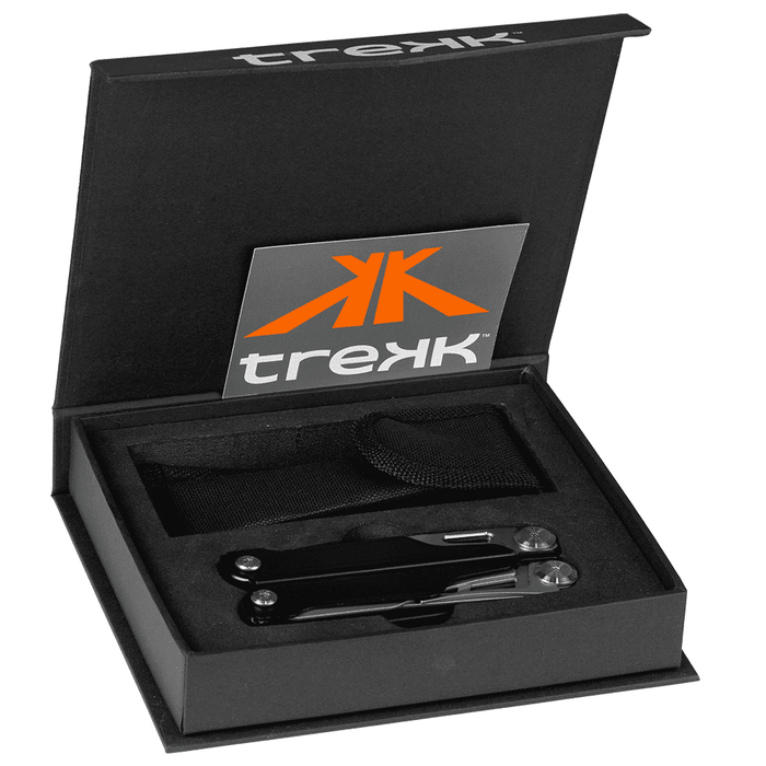 Trekk Survival Multi-Tool - A black multi-tool set is displayed in an open box with a logo and a storage band.
