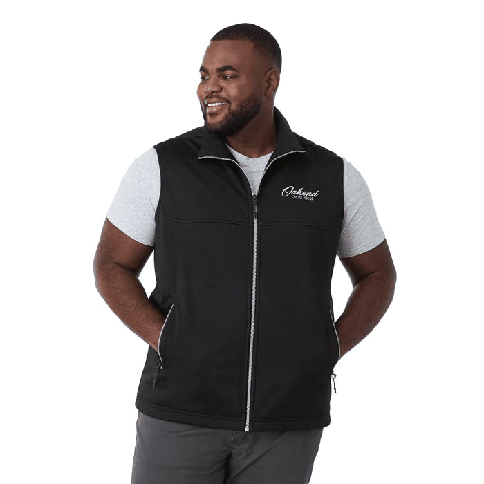 Men's Joris Eco Waterproof Softshell Vest - A black eco waterproof softshell vest featuring a zip front and side pockets, worn by a smiling man.