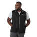 Men's Joris Eco Waterproof Softshell Vest - A black eco waterproof softshell vest featuring a zip front and side pockets, worn by a smiling man.
