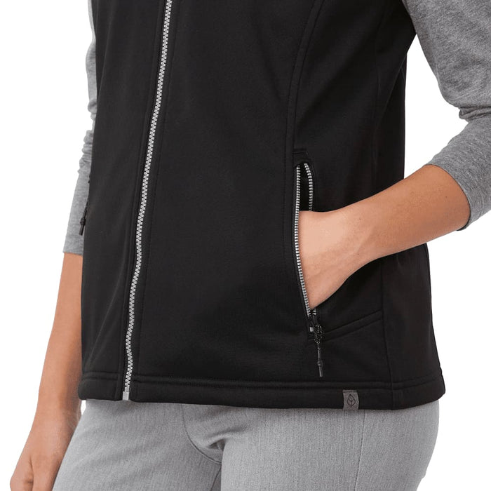 Women's Joris Eco Waterproof Softshell Vest - A black women's softshell vest featuring a zip front and side pockets, with grey sleeves and a branding logo.