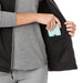 Women's Joris Eco Waterproof Softshell Vest - A black women's softshell vest with a zippered pocket, featuring a grey long-sleeve shirt underneath.