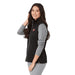 Women's Joris Eco Waterproof Softshell Vest - A woman wearing a black and grey eco waterproof softshell vest with a logo. The vest features a zip front and side pockets.