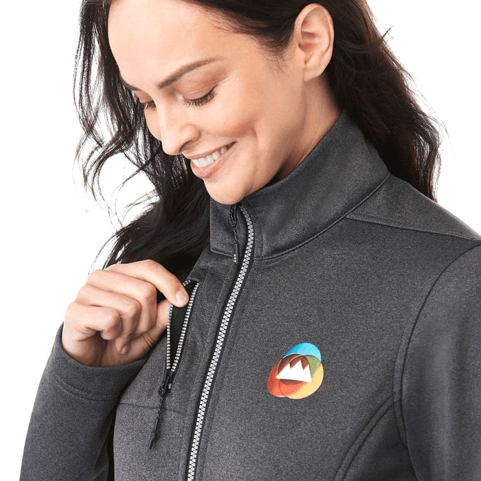 Women's Joris Eco Waterproof Softshell Jacket - A grey women's softshell jacket with a zippered pocket, featuring a colourful logo on the chest.