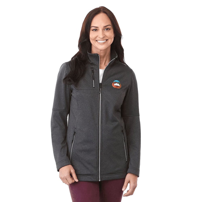 Women's Joris Eco Waterproof Softshell Jacket - A woman wearing a charcoal grey softshell jacket with a logo on the chest and zippered pockets.