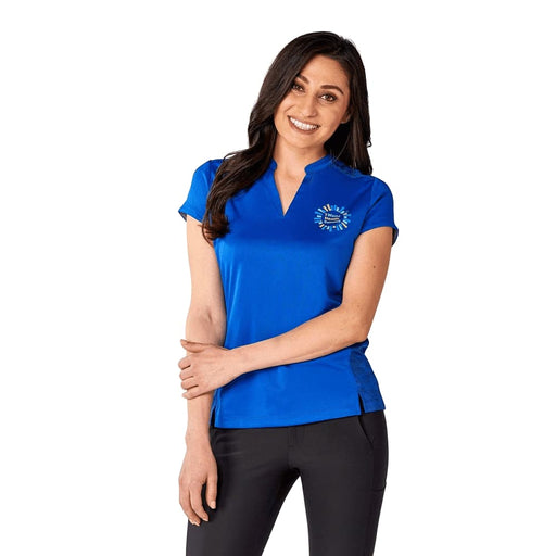 Women's Piedmont Short Sleeve Performance Polo - A woman is wearing a vibrant blue short sleeve performance polo shirt with a logo on the chest.