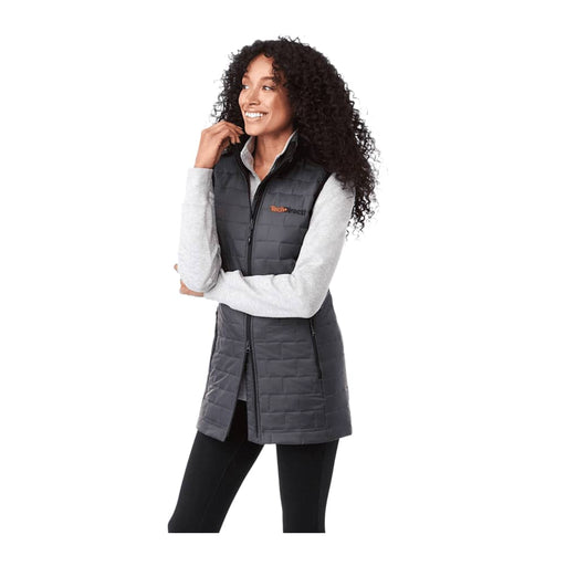 Women's Telluride Lightweight Packable Insulated Puffer Vest - A lightweight, insulated puffer vest in black, featuring a high collar and zip closure, modelled by a smiling woman.