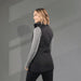 Women's Telluride Lightweight Packable Insulated Puffer Vest - A black women's insulated puffer vest with a fitted silhouette, featuring a high collar and sleek design.