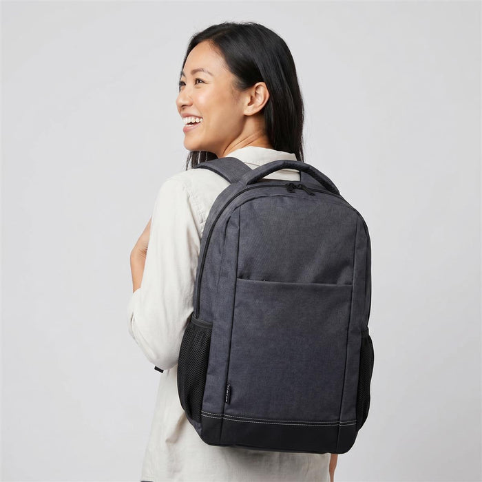 Tirano Laptop Backpack - A grey and black laptop backpack is shown worn on the back of a smiling person, featuring a logo.
