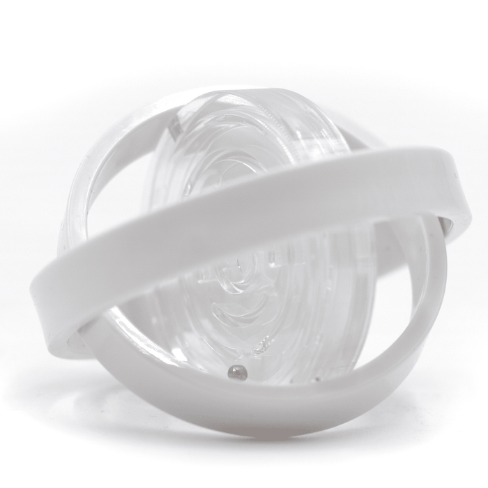 The Amazing Fidget - A clear fidget toy with a white band encircling a spinning inner component. Features a smooth, transparent design.